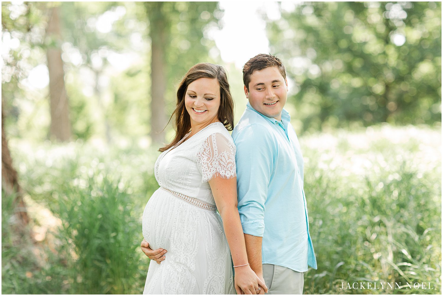 Couples Maternity pose idea for maternity photography session taken at St. Louis Forest Park by Jackelynn Noel Photography | St. Louis Photographer
