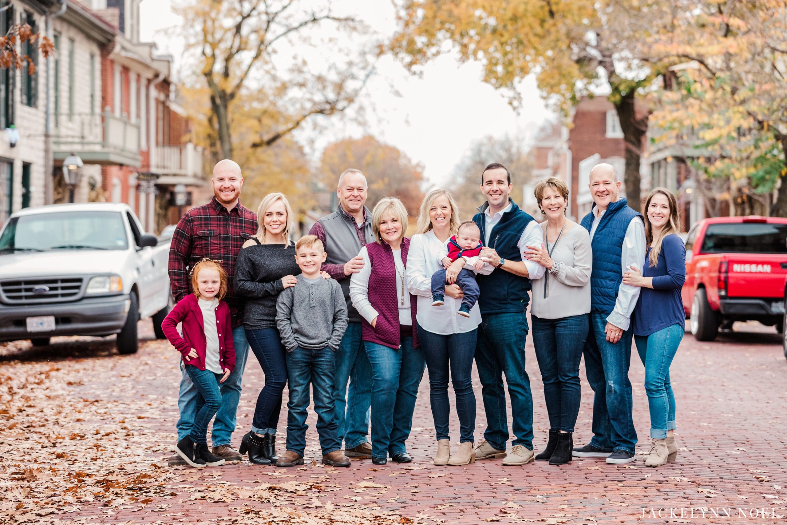 Big family photos on Main Street in St. Charles, MO by Jackelynn Noel Photography