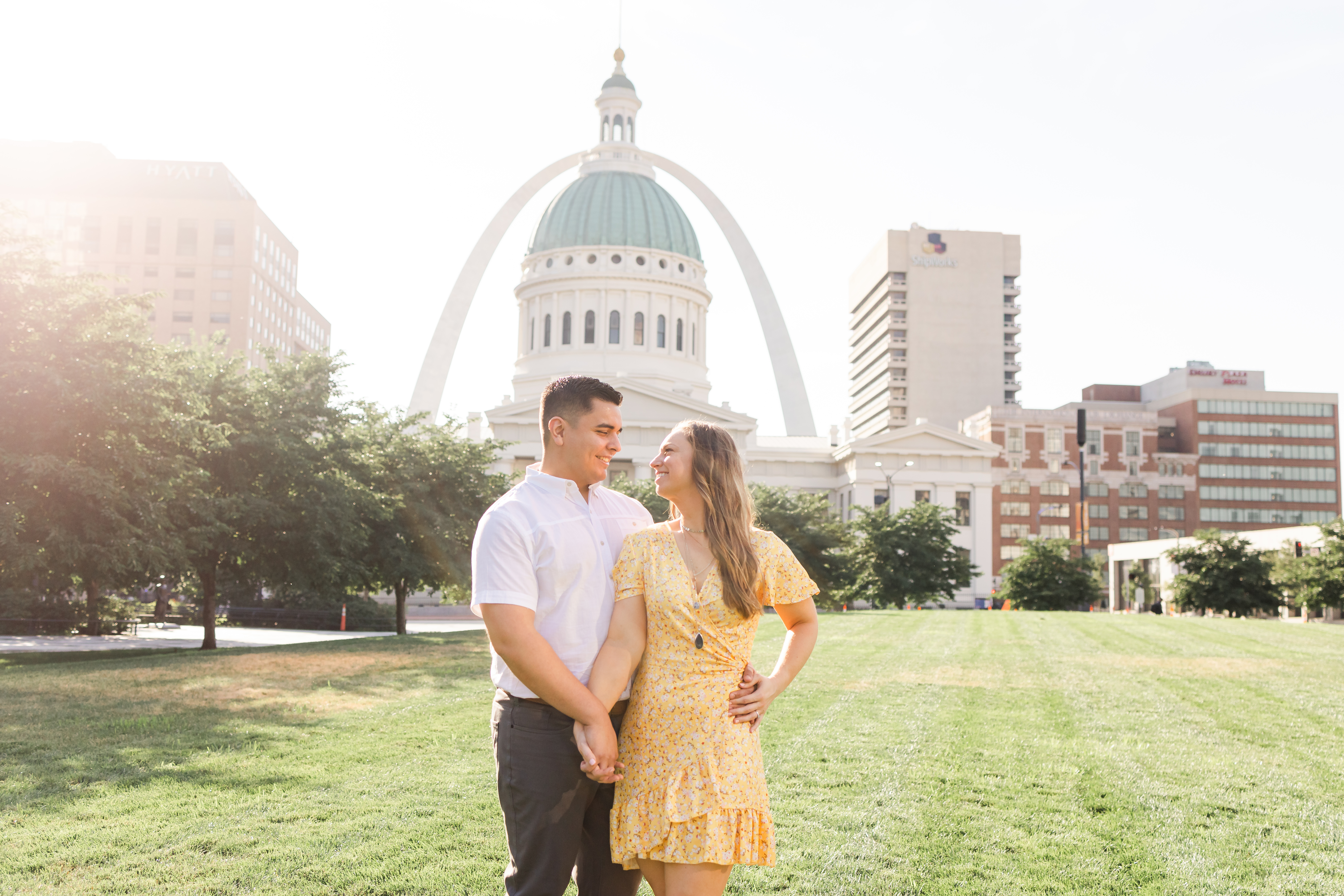 Sunrise engagement session at Kiener Plaza with the arch St. Louis, MO